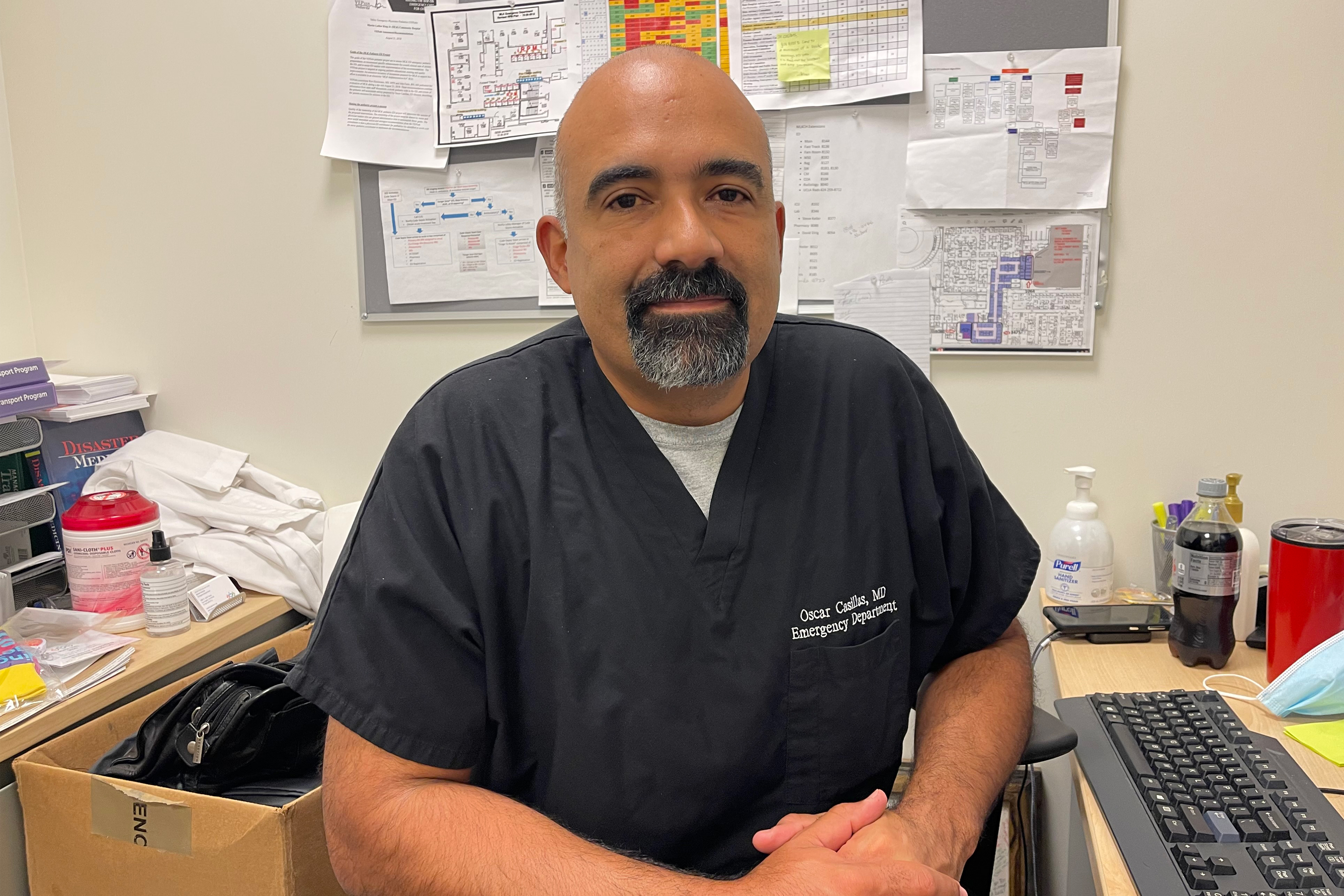 A photo shows Oscar Casillas sitting in an office.