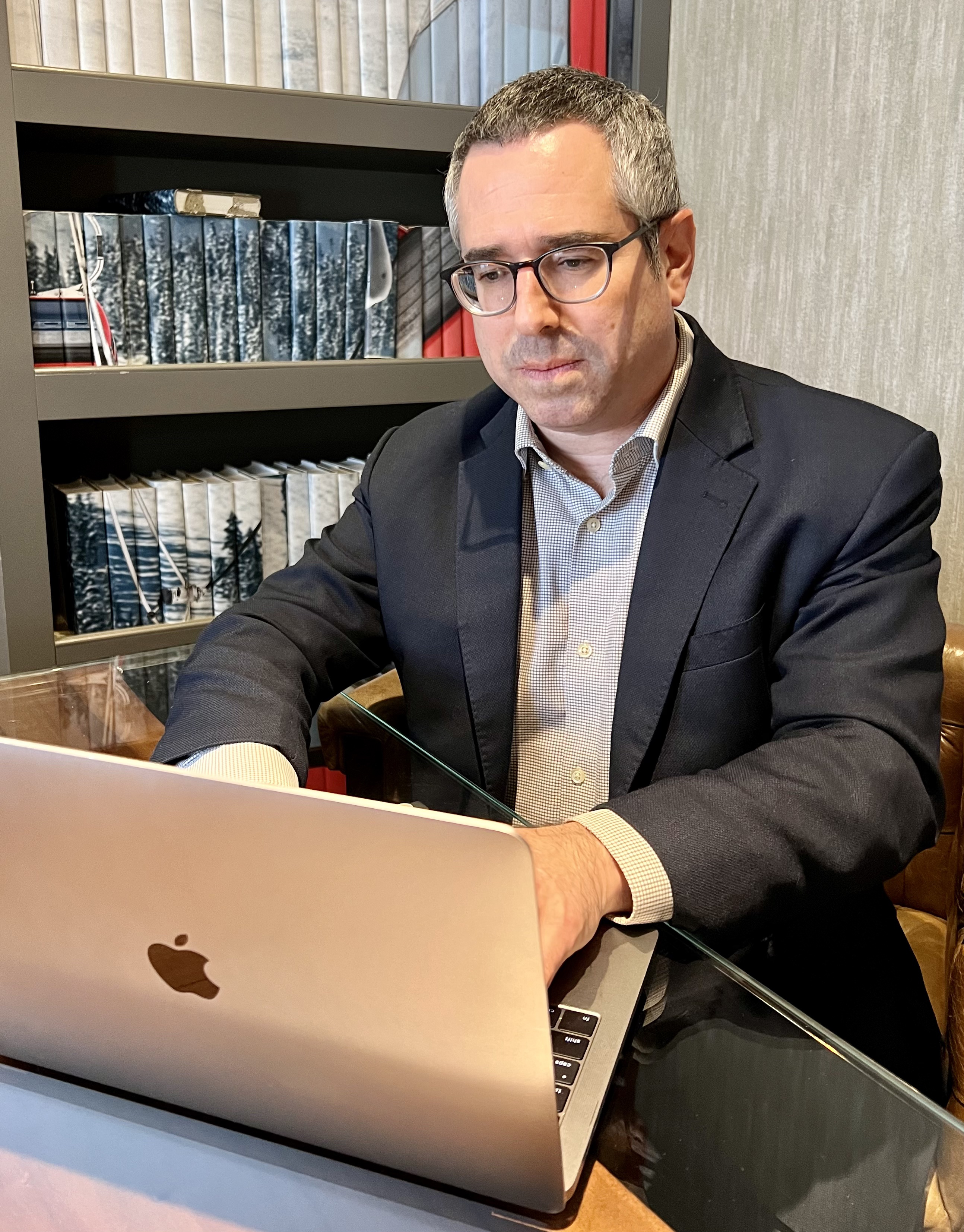 A photo shows Dr. Corey Siegel using a laptop.