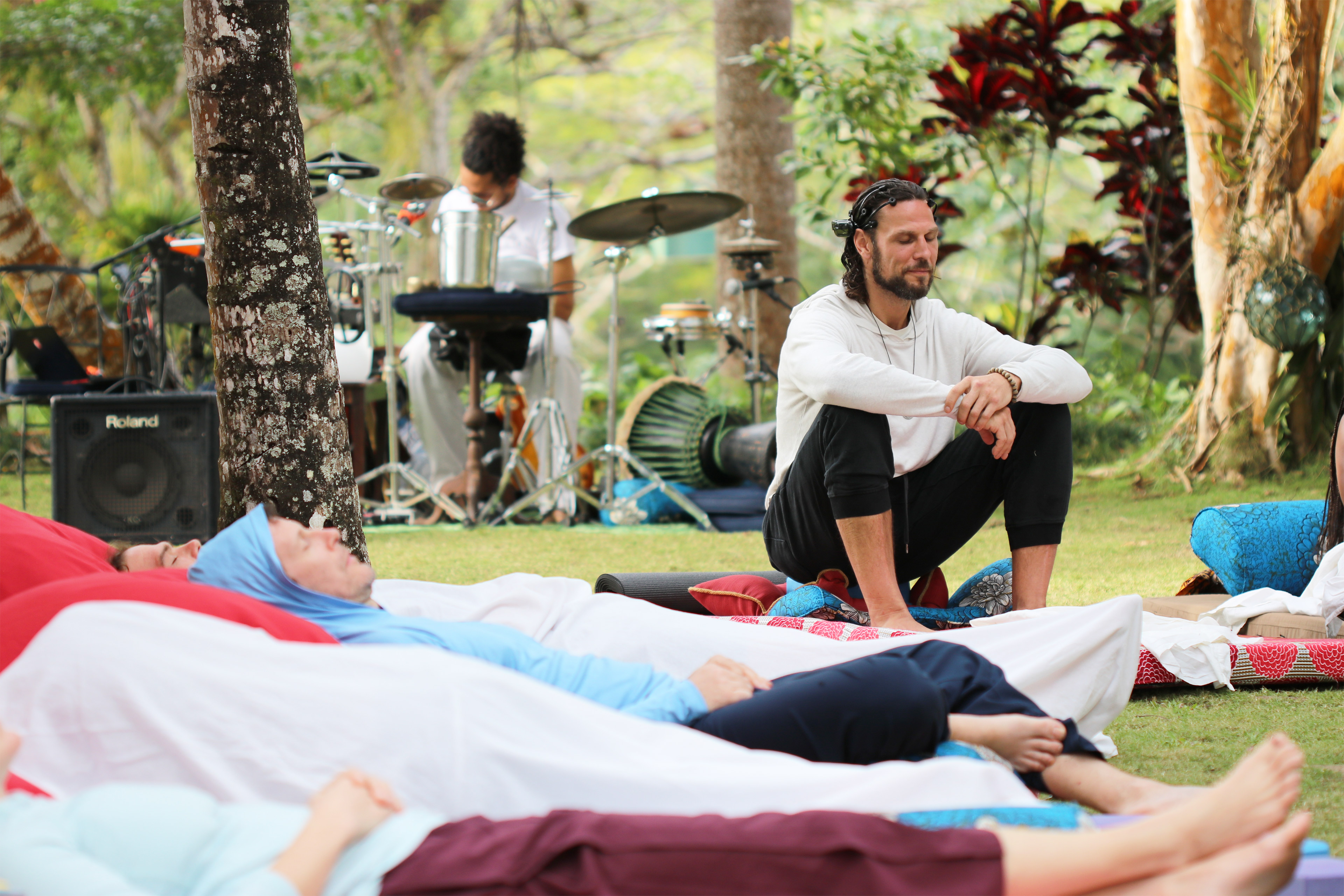 A photo of Riley Cote sitting during a mushroom ceremony.
