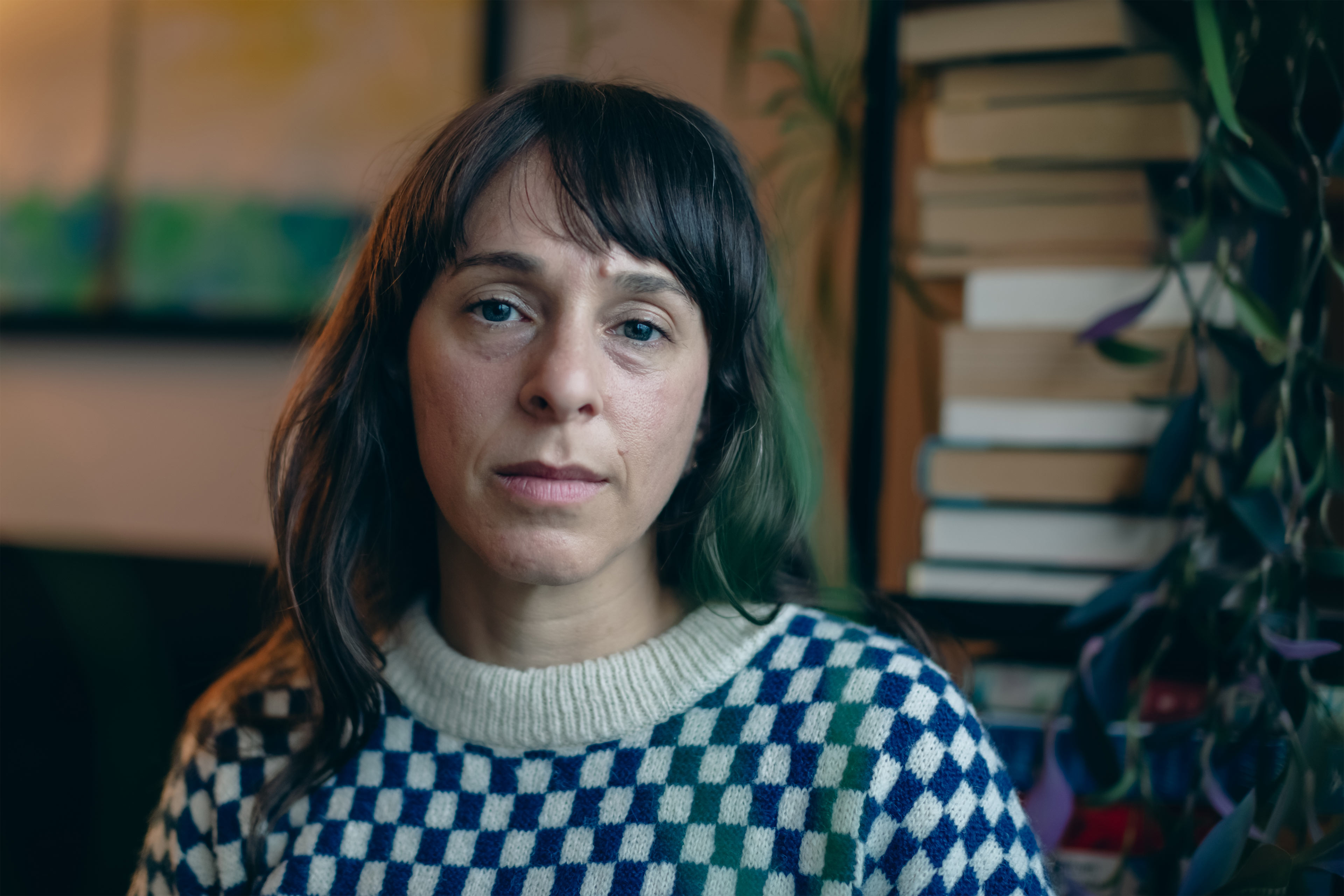 A portrait of a woman indoors.