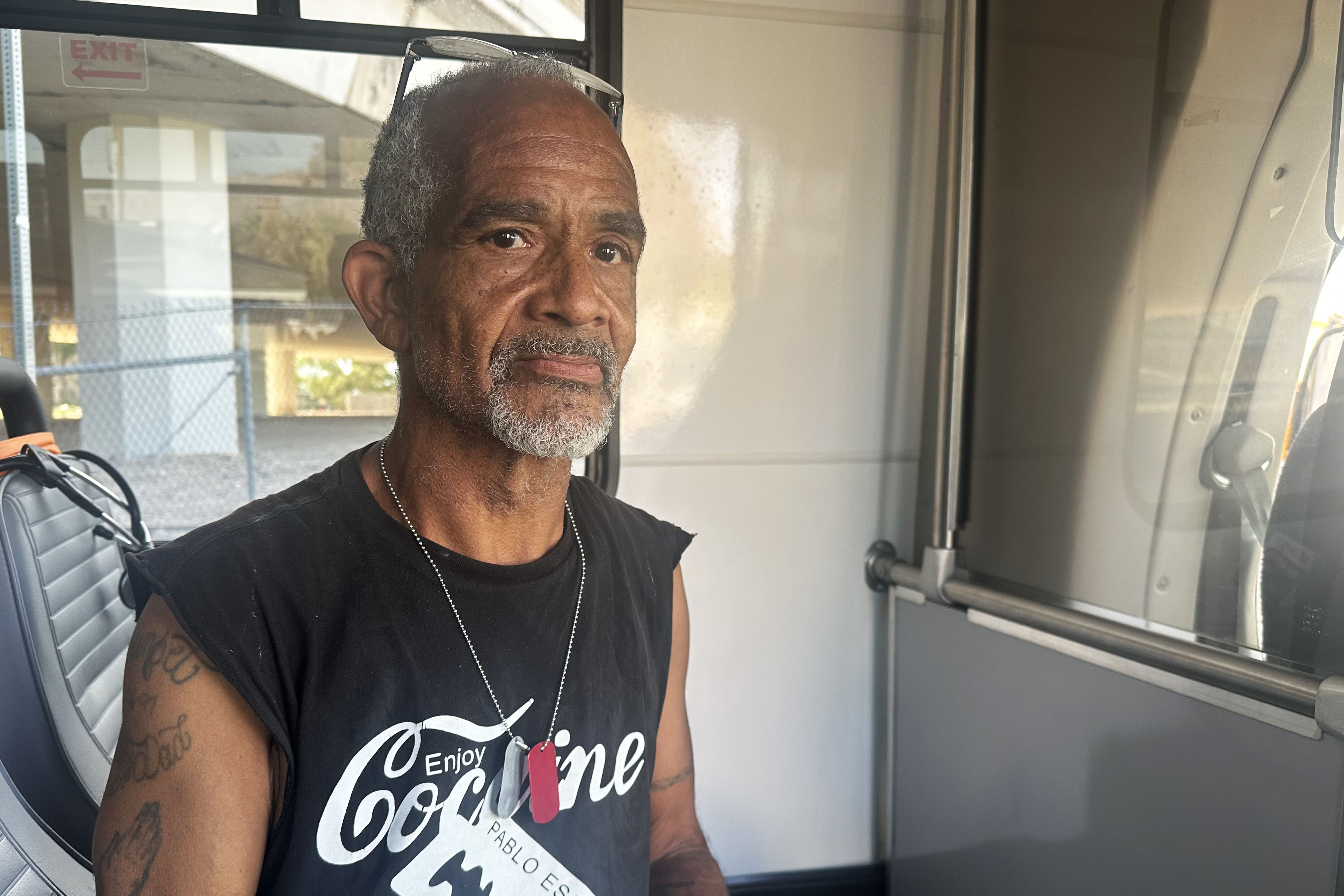 A portrait of John Harris. a middle-aged man with a short gray facial hair.