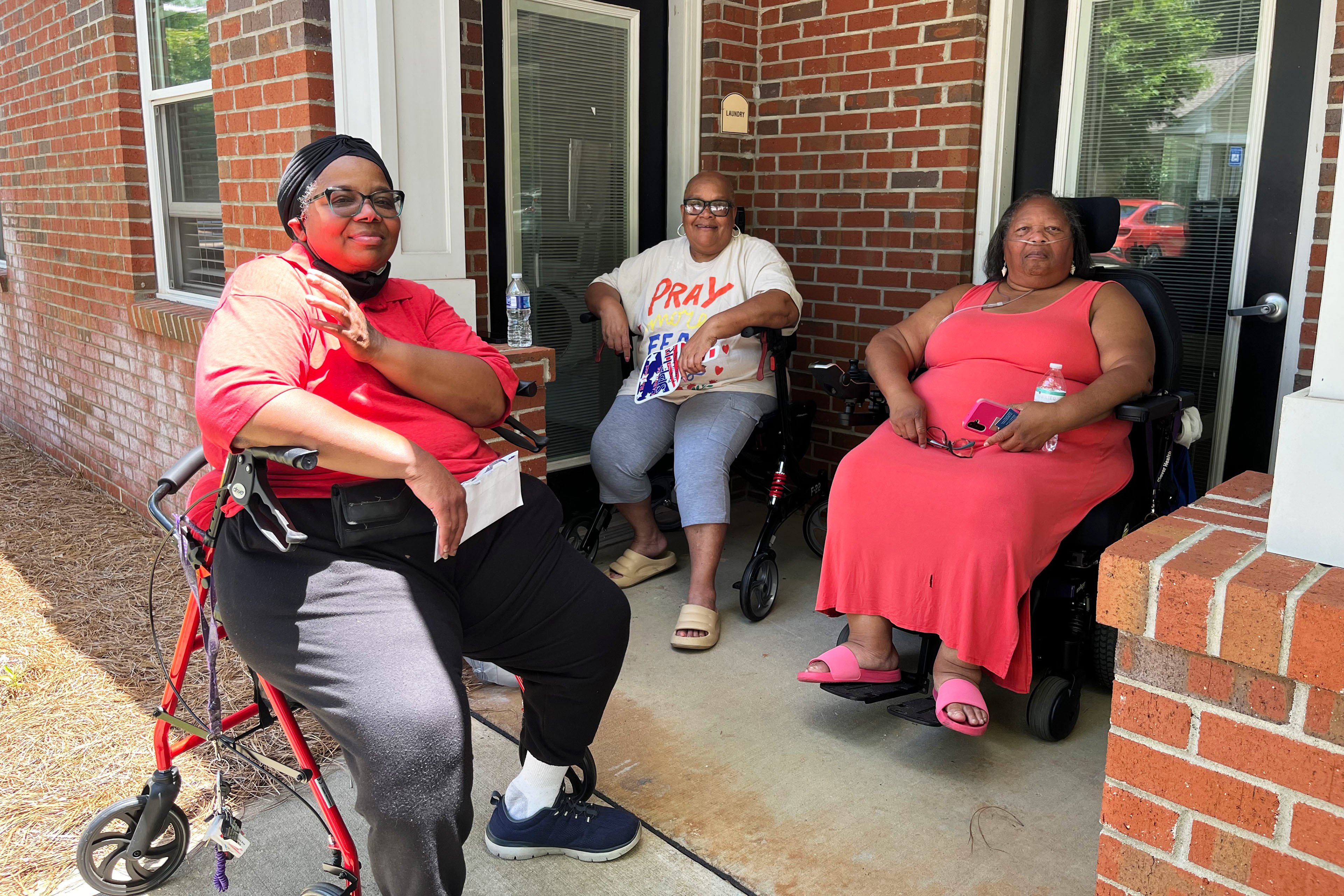 A photo of three Black women seated outside in southwestern Georgia.