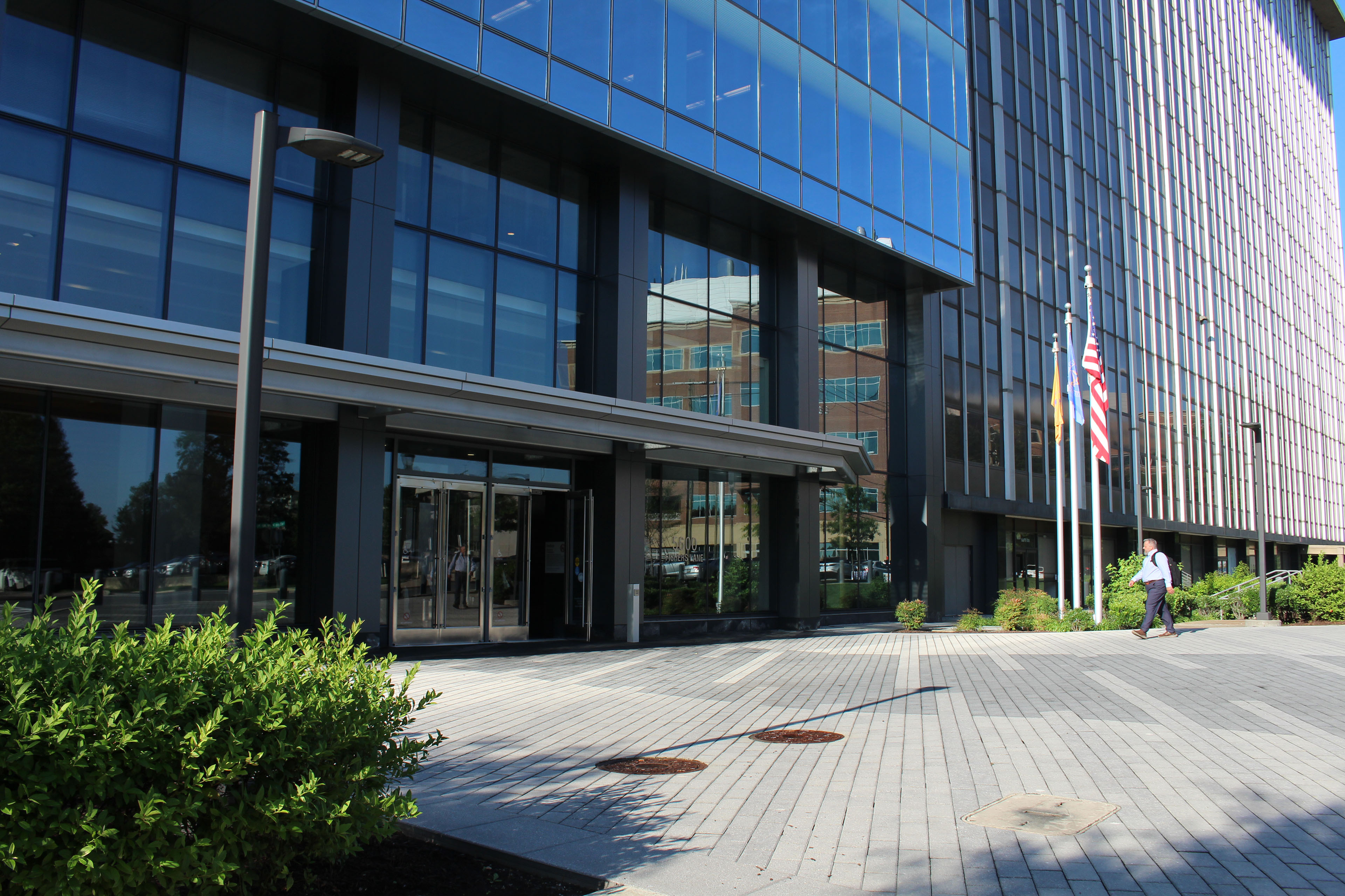 The outdoor entrance to a modern glass building.
