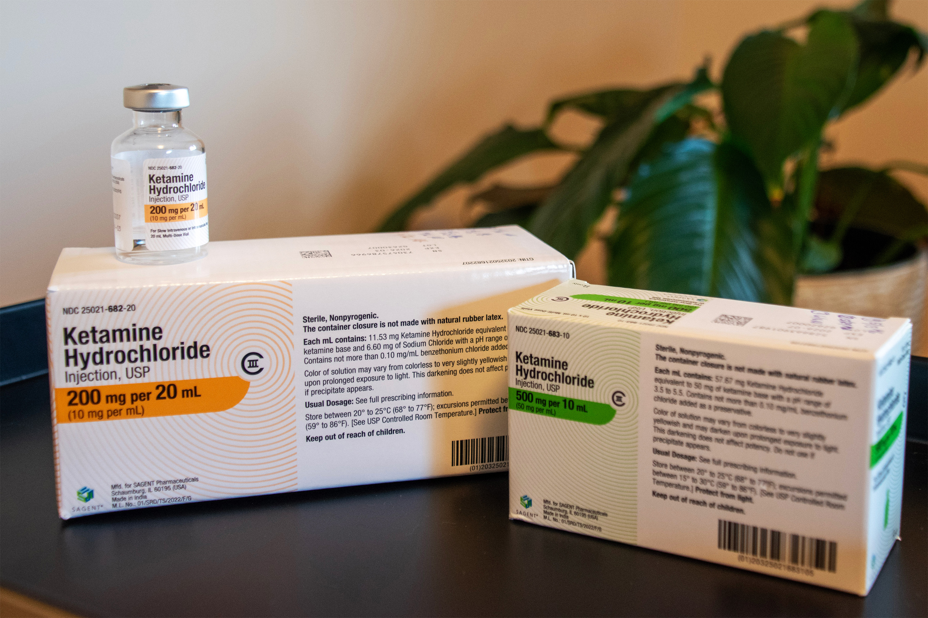 A photo of two boxes of ketamine. A vial of the drug sits on top of the left box.