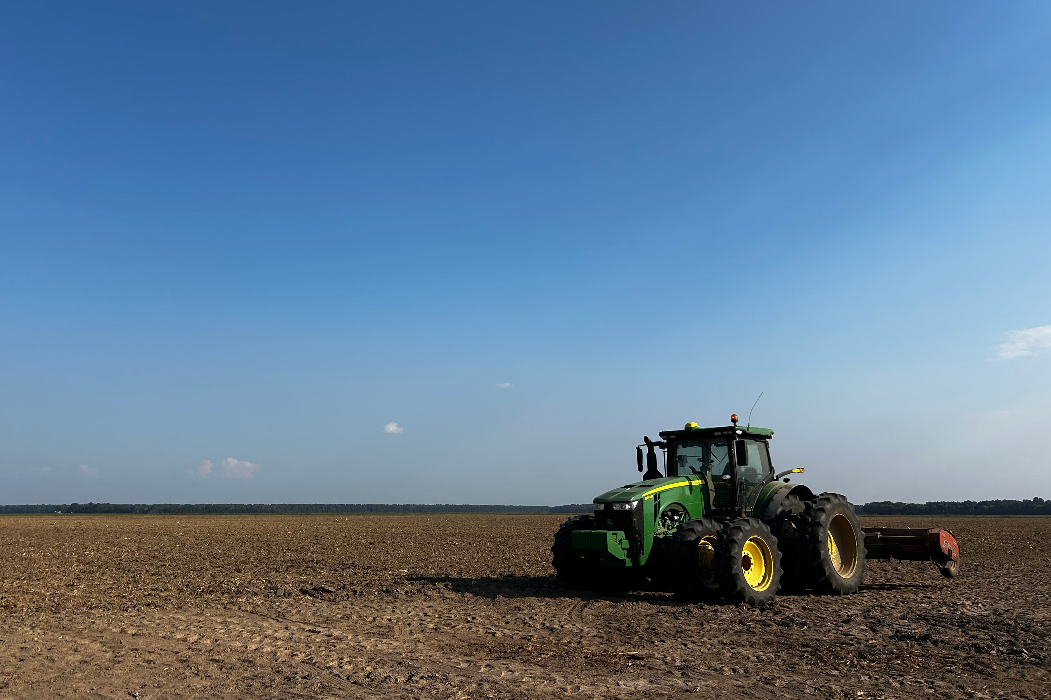 A tractor parked in a field.